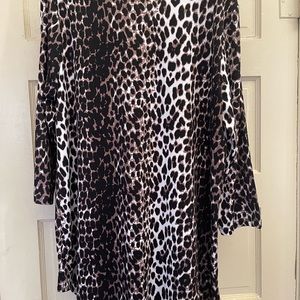 Women in Control Large Tunic in animal print. Hi/Low Hem. 95% poly 5% Spandex.